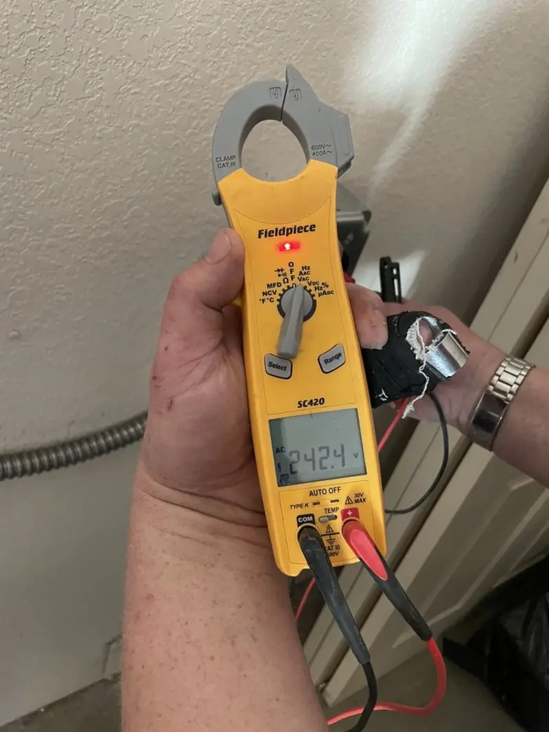 Voltage testing with clamp meter during Electrical Installation Services in Winterport